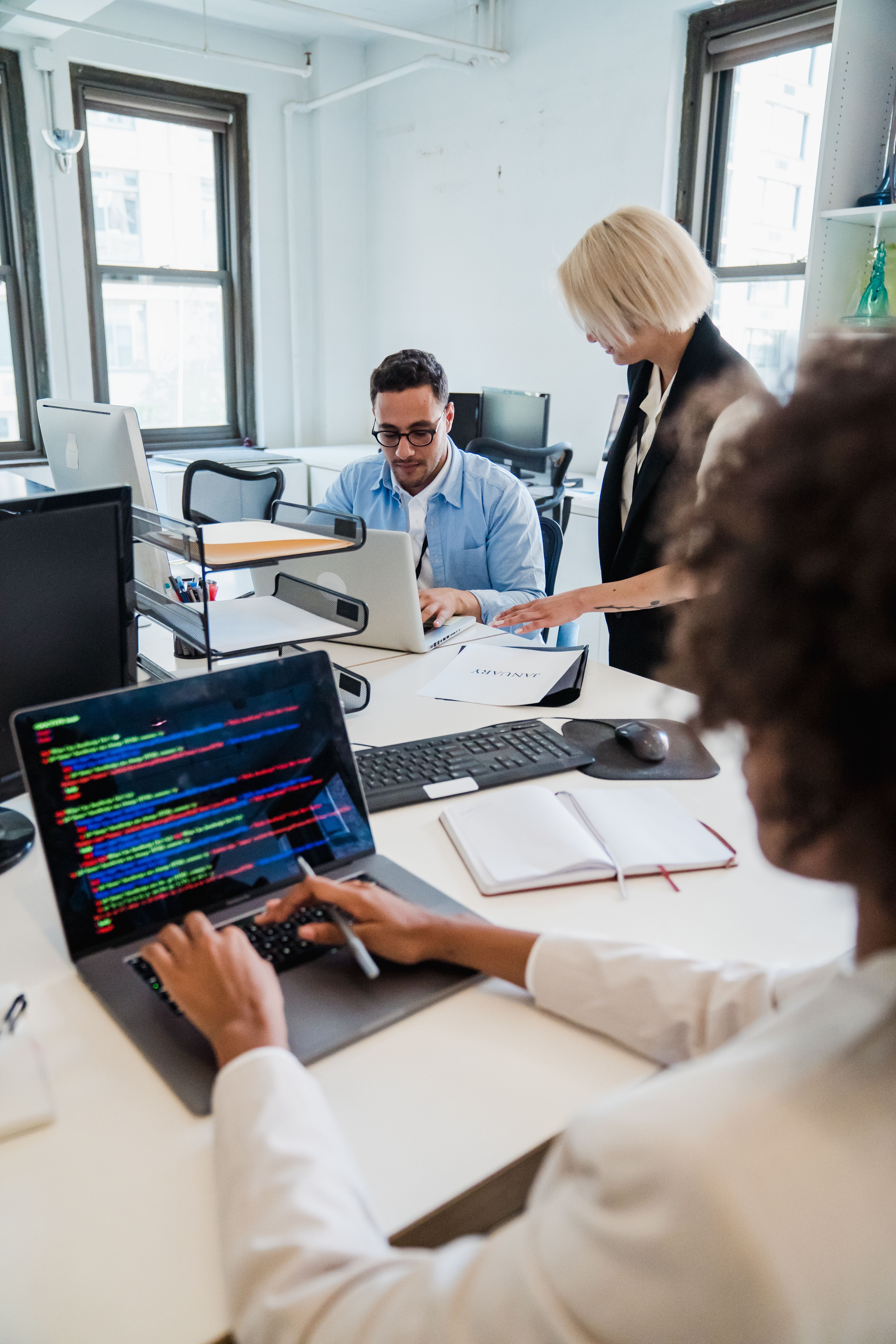 A technology team working through a project together