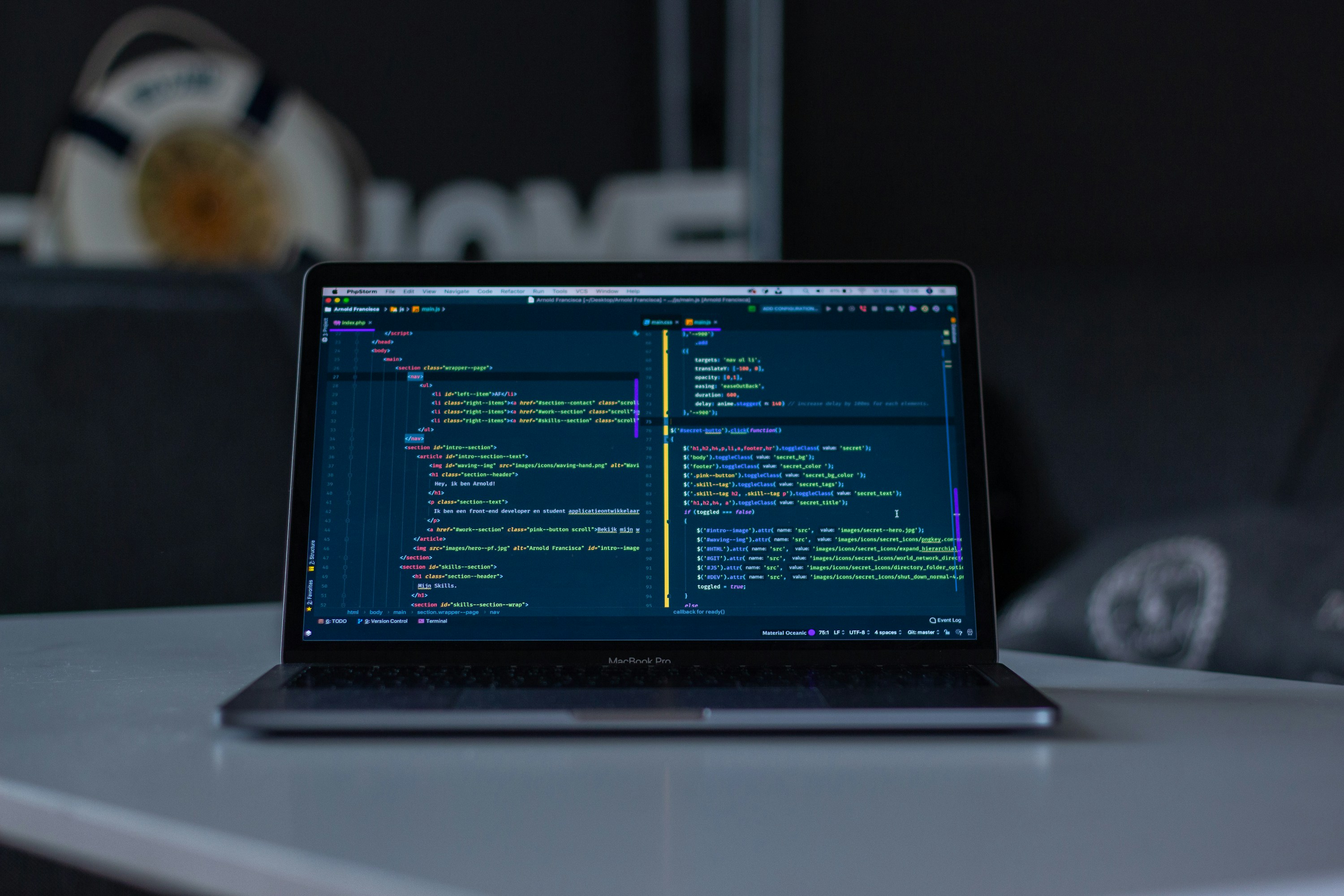 A developer reviewing code on a laptop